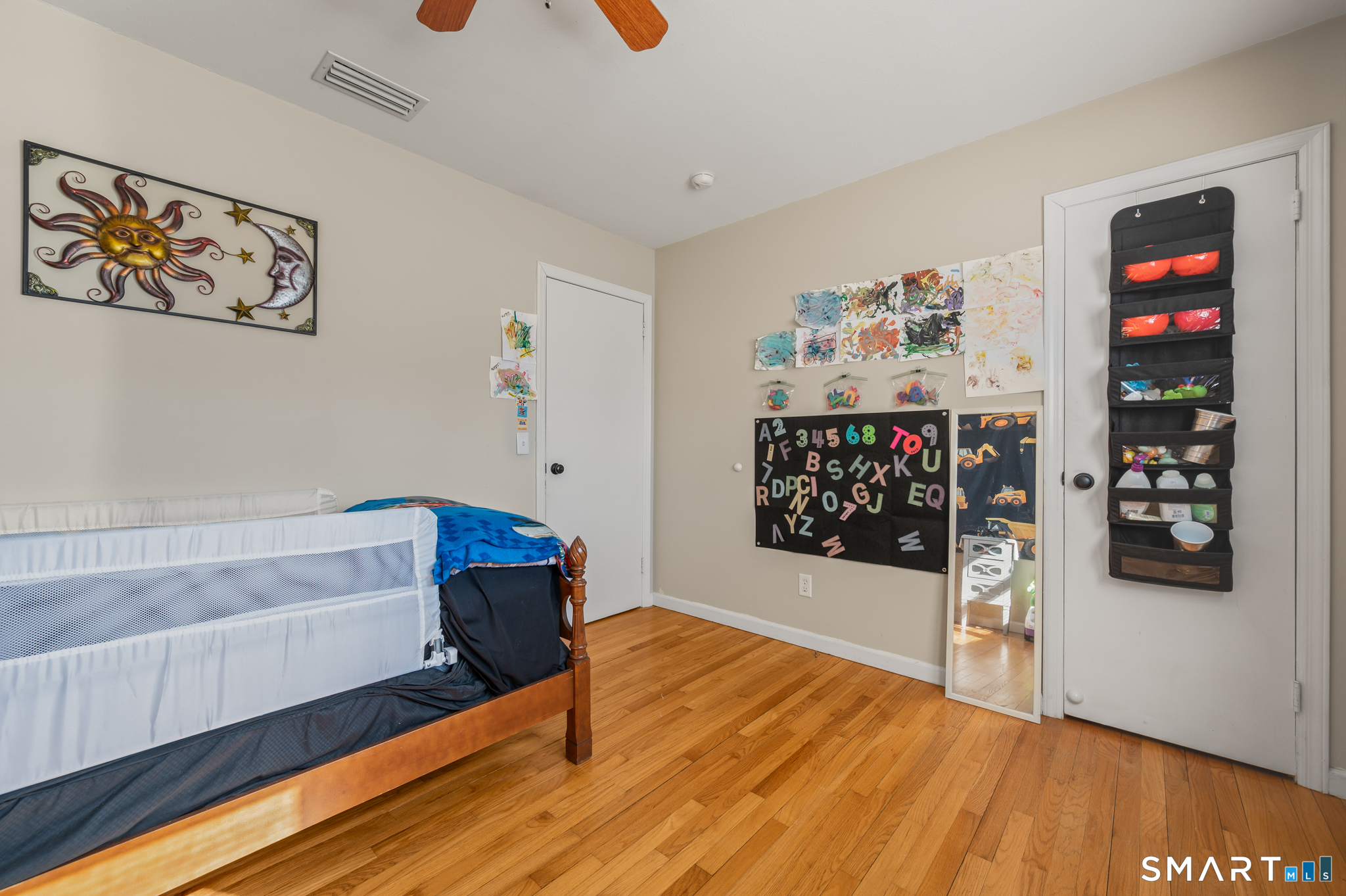 192 Wolcott Hill Road Wethersfield, CT 06109 - Photo 21 of 35 a living room with furniture and wooden floor