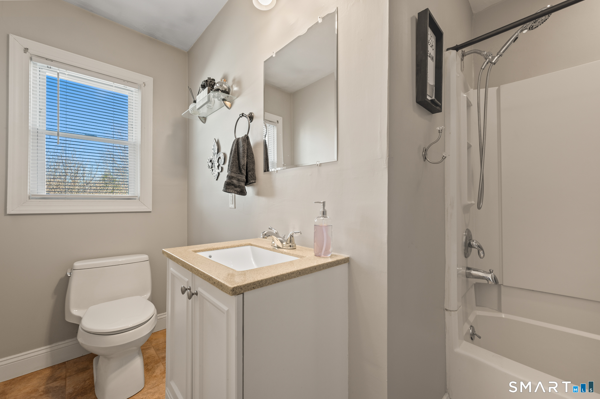 192 Wolcott Hill Road Wethersfield, CT 06109 - Photo 22 of 35 a bathroom with a toilet a sink a bath tub and mirror