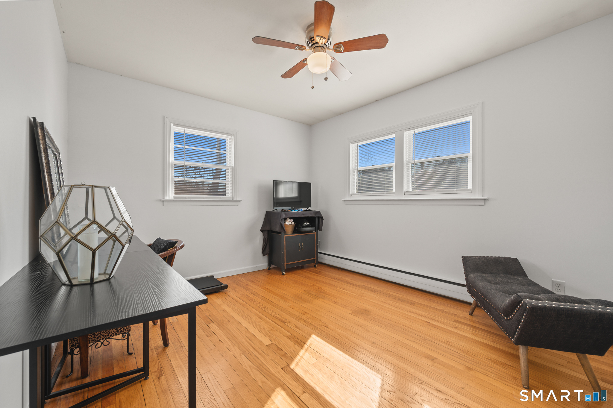 192 Wolcott Hill Road Wethersfield, CT 06109 - Photo 23 of 35 a bedroom with furniture and wooden floor