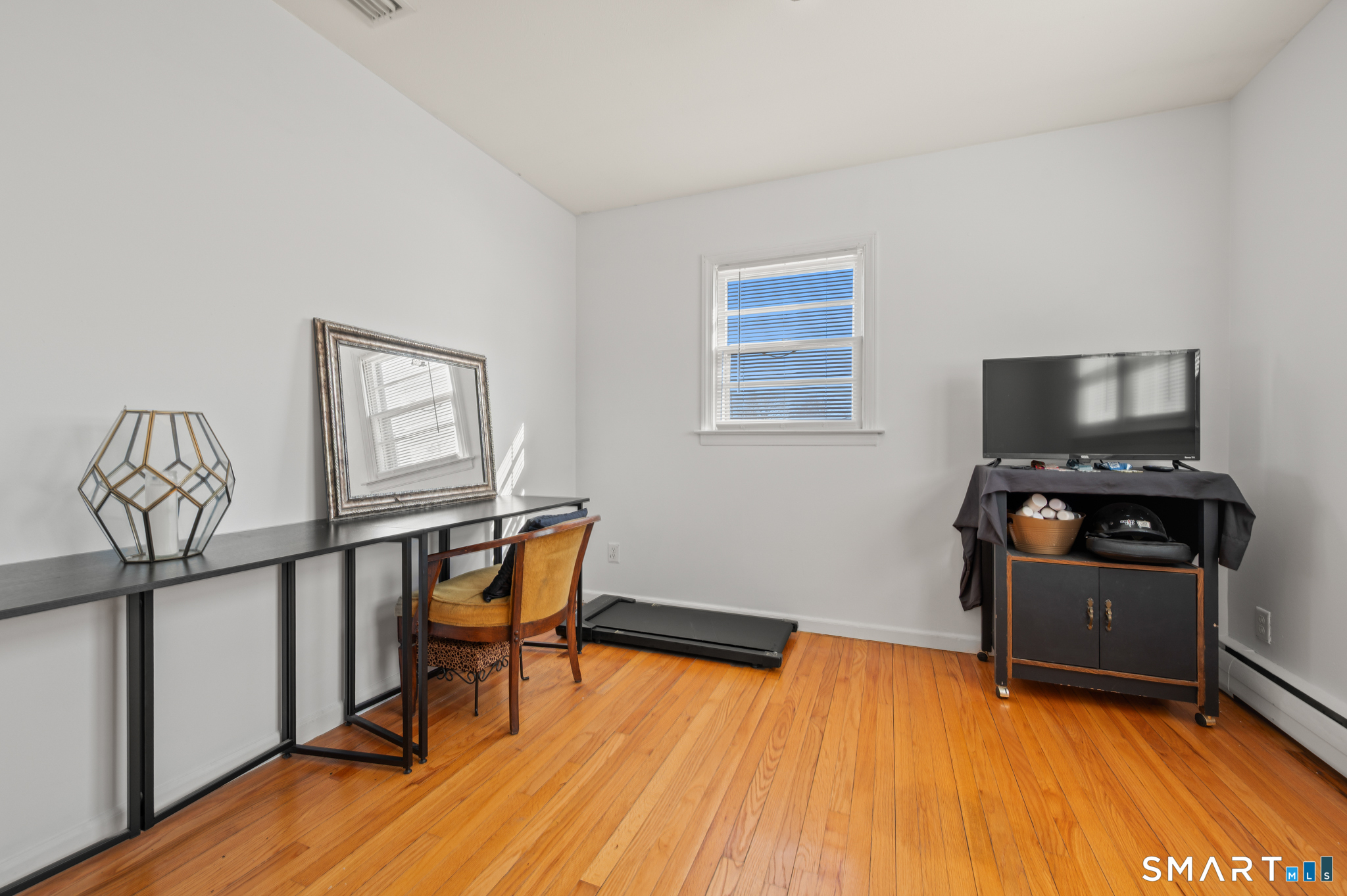 192 Wolcott Hill Road Wethersfield, CT 06109 - Photo 24 of 35 a living room with furniture and a flat screen tv