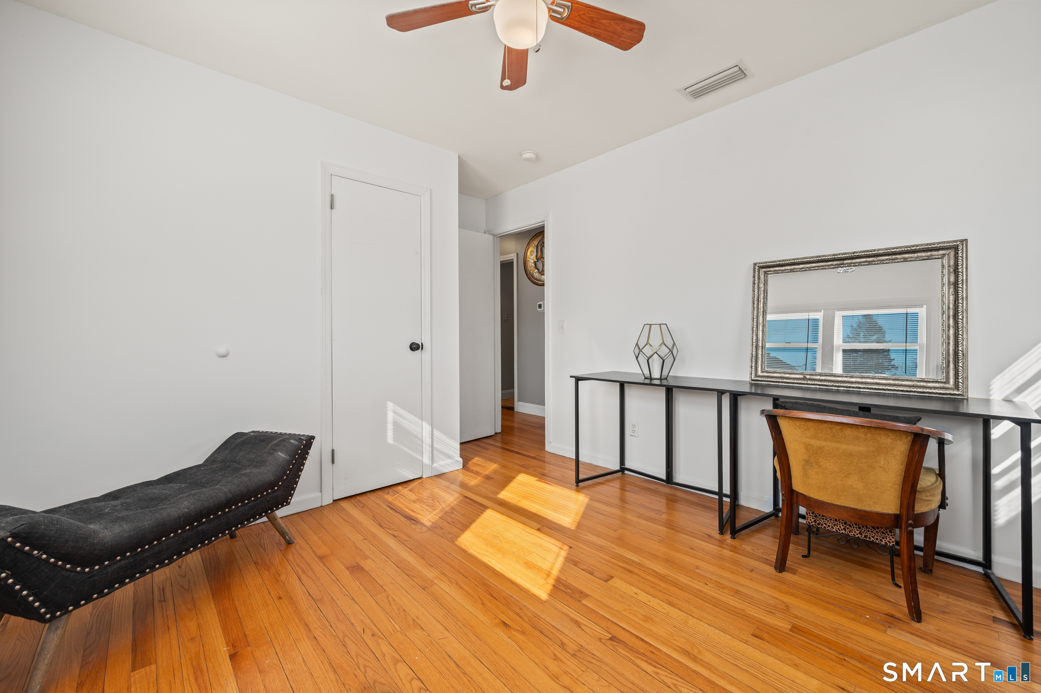 192 Wolcott Hill Road Wethersfield, CT 06109 - Photo 25 of 35 a bedroom with a bed and a dresser