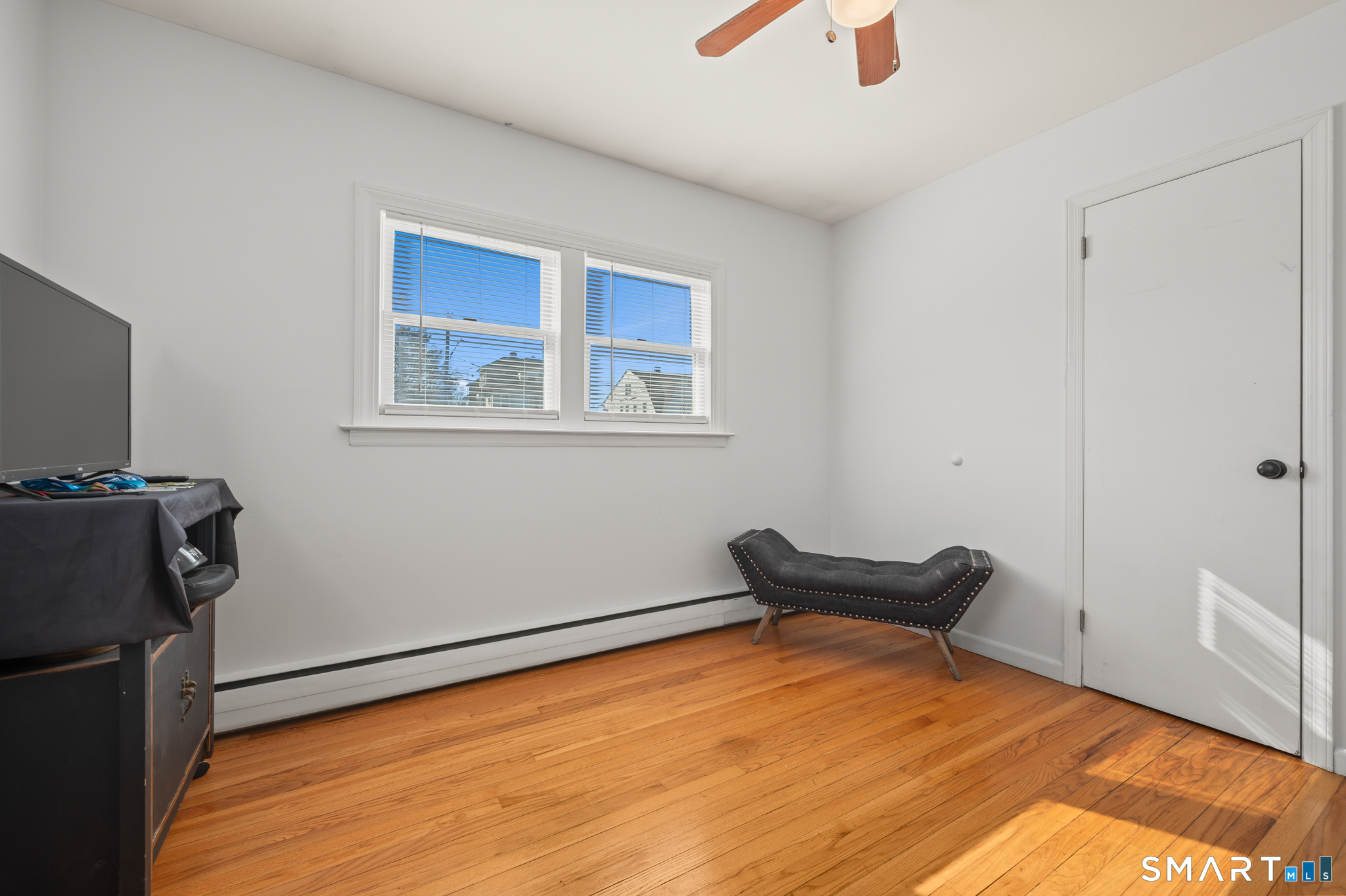 192 Wolcott Hill Road Wethersfield, CT 06109 - Photo 26 of 35 a blue bed sitting in a room next to a window