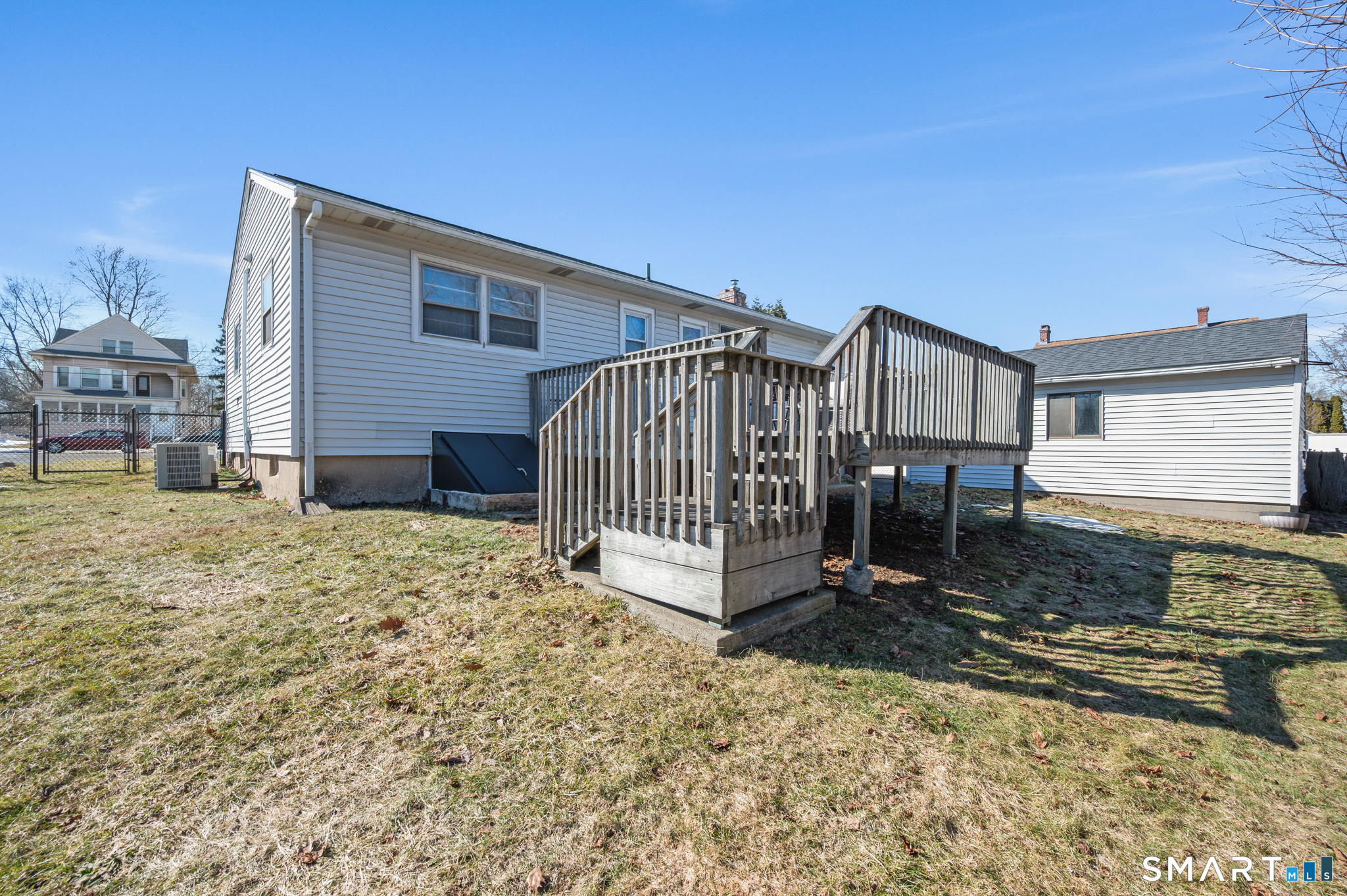 192 Wolcott Hill Road Wethersfield, CT 06109 - Photo 28 of 35 a view of a house with a yard