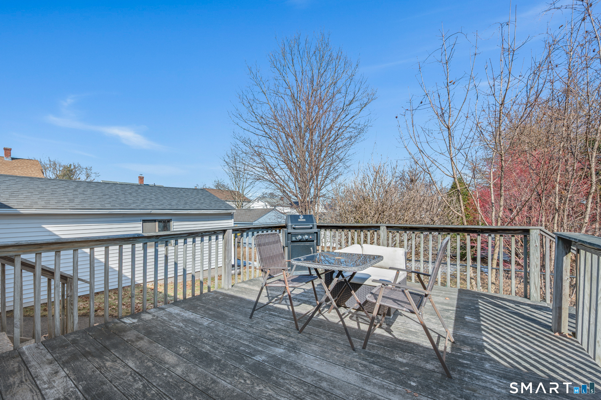 192 Wolcott Hill Road Wethersfield, CT 06109 - Photo 30 of 35 a view of a chairs and table on the wooden floor