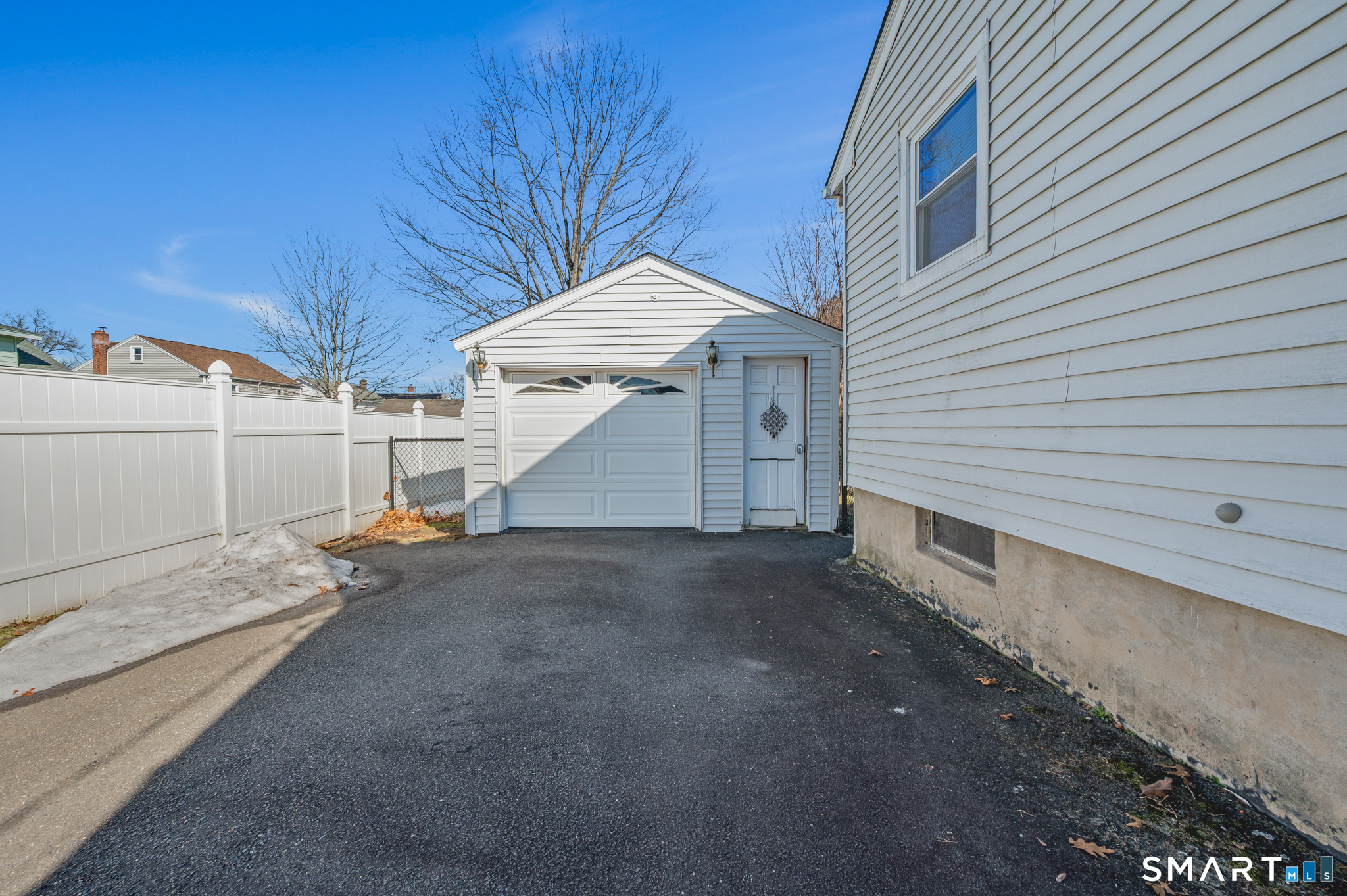 192 Wolcott Hill Road Wethersfield, CT 06109 - Photo 31 of 35 a view of a house with a yard