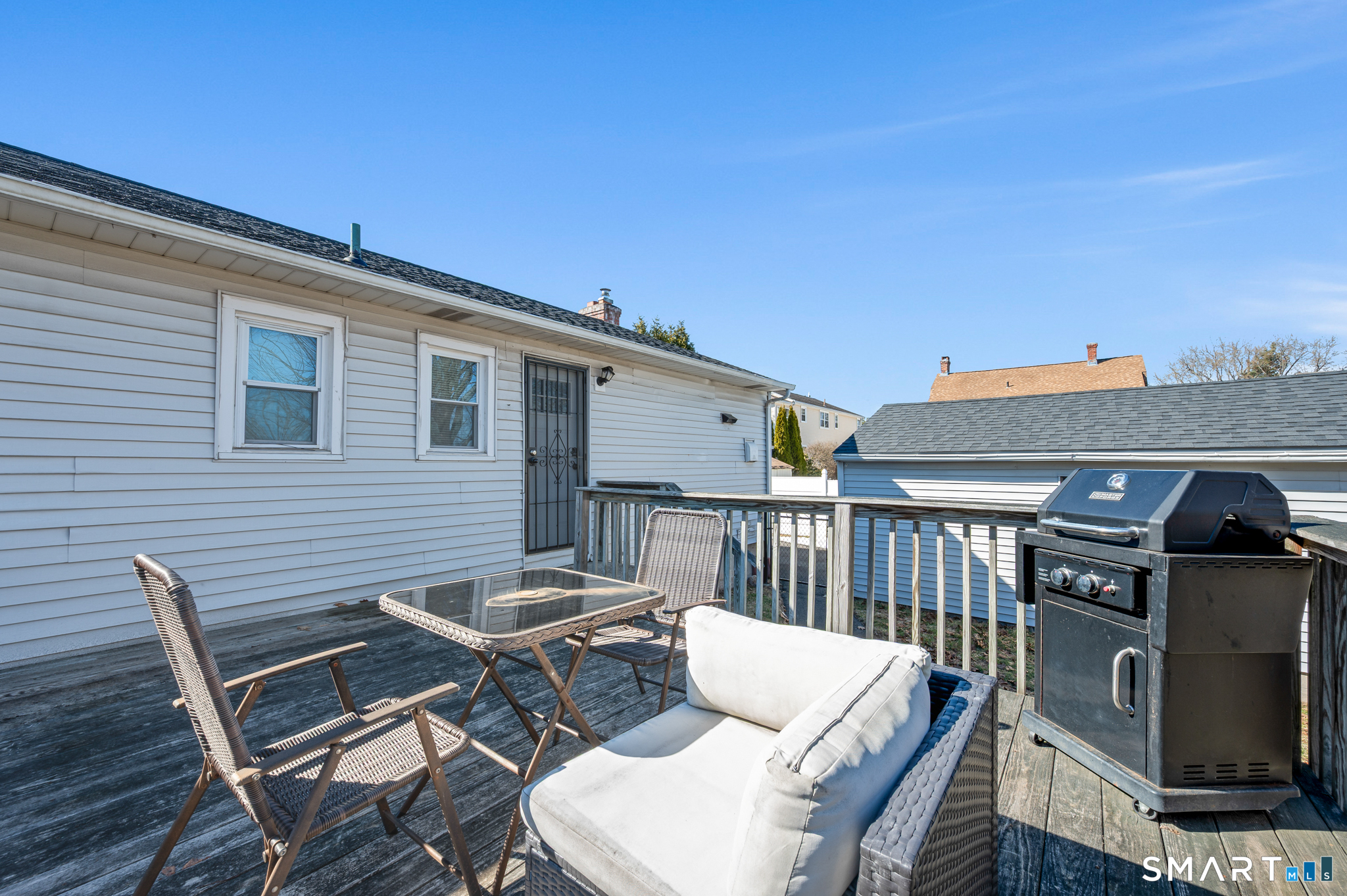 192 Wolcott Hill Road Wethersfield, CT 06109 - Photo 33 of 35 a view of a patio with a table and chairs