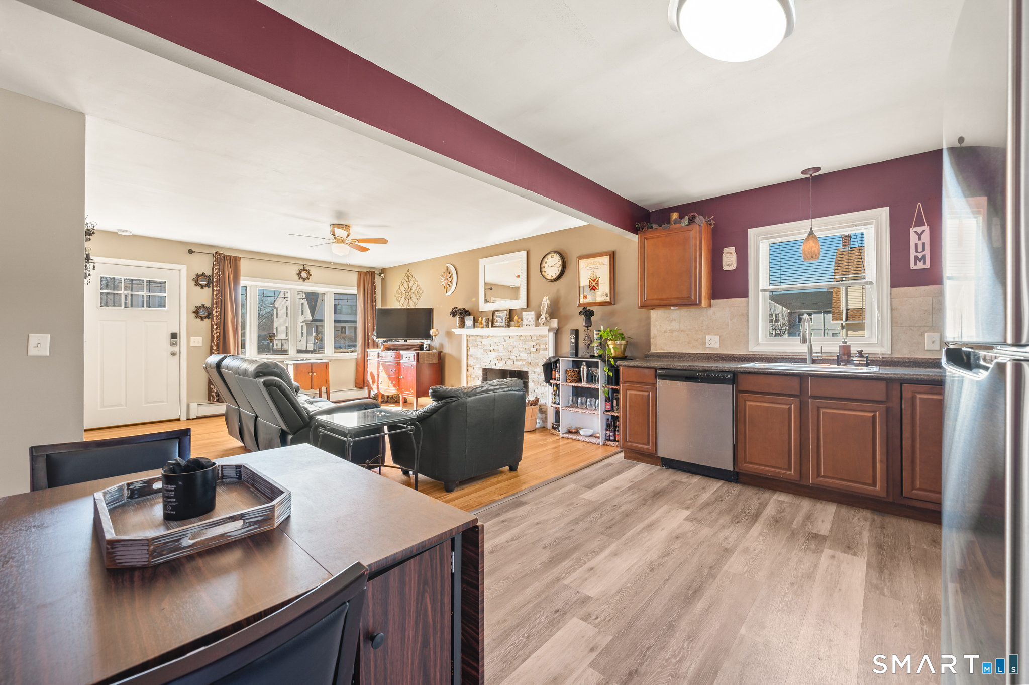 192 Wolcott Hill Road Wethersfield, CT 06109 - Photo 6 of 35 a living room with stainless steel appliances kitchen island granite countertop furniture a large window and a sink