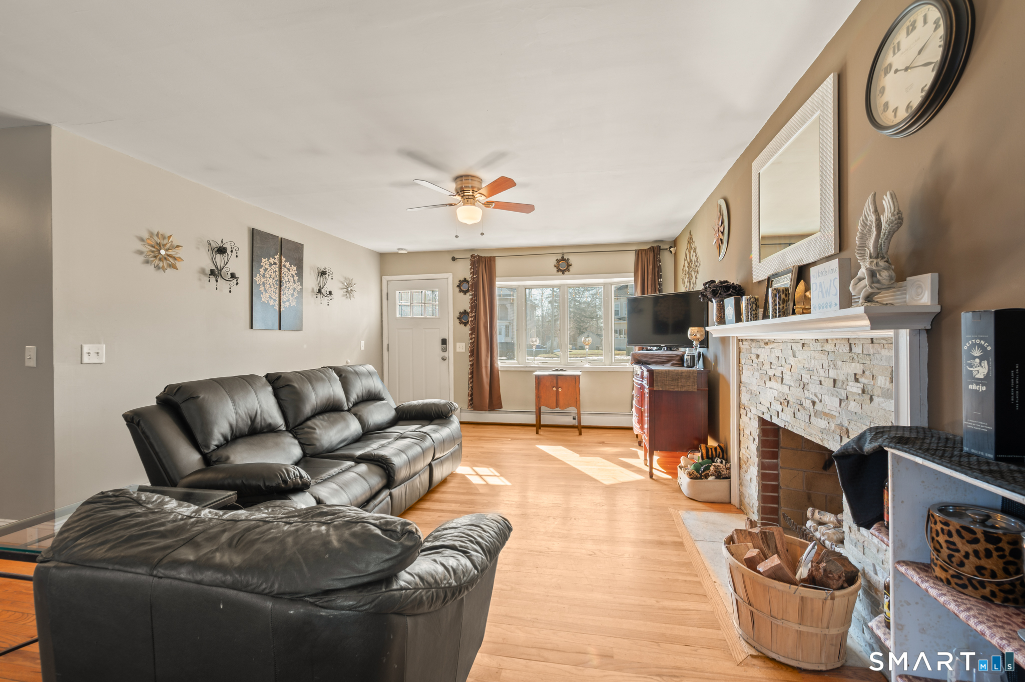 192 Wolcott Hill Road Wethersfield, CT 06109 - Photo 8 of 35 a living room with furniture and a fireplace