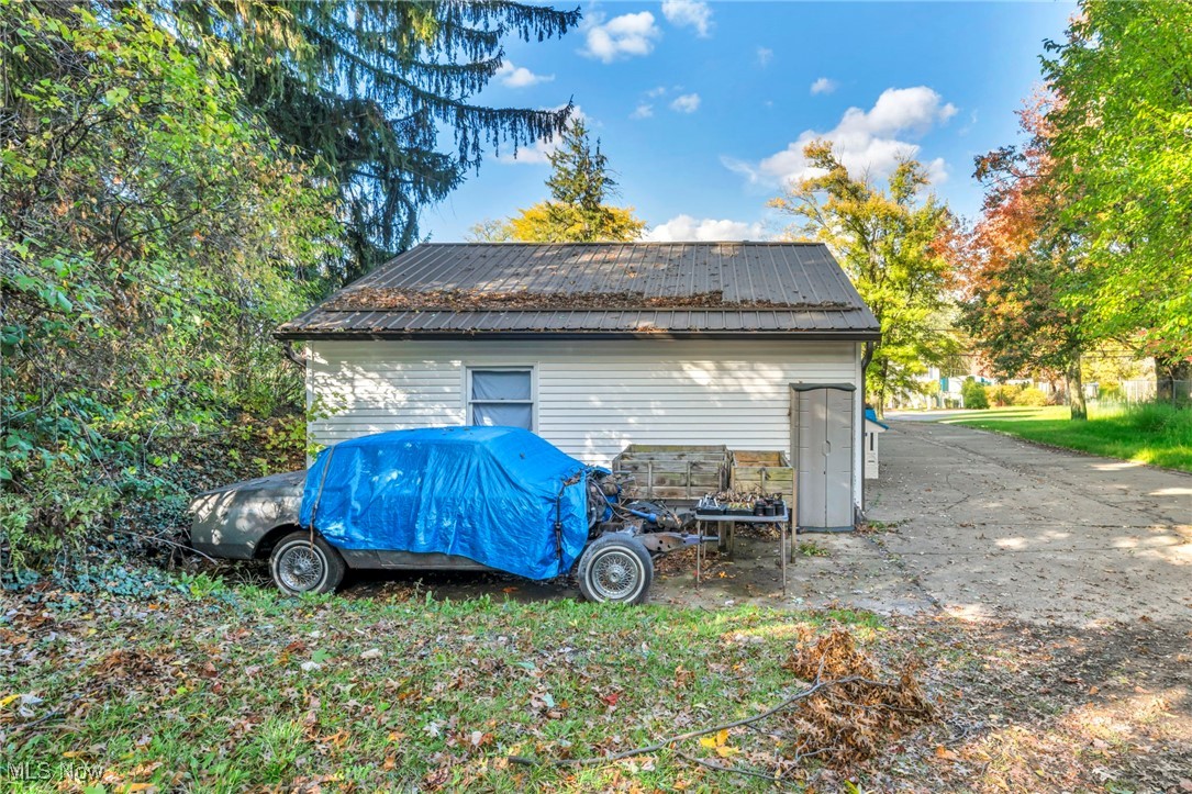 6984 Warren - Sharon Road Brookfield, OH 44403 - Photo 38 of 46 View of home's exterior featuring a metal roof and an outbuilding