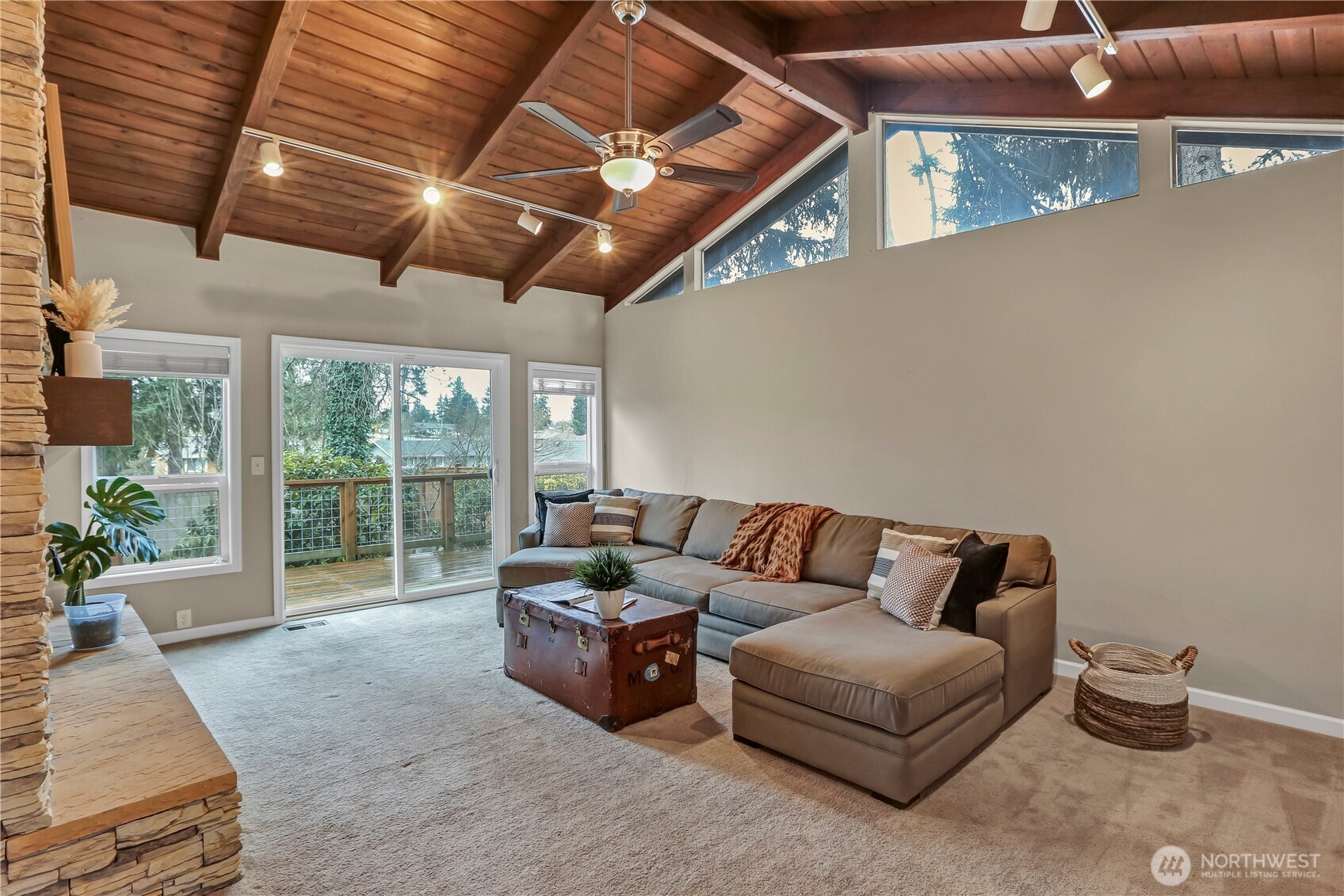 16387 129th Avenue Southeast Renton, WA 98058 - Photo 16 of 30 a living room with furniture and a floor to ceiling window