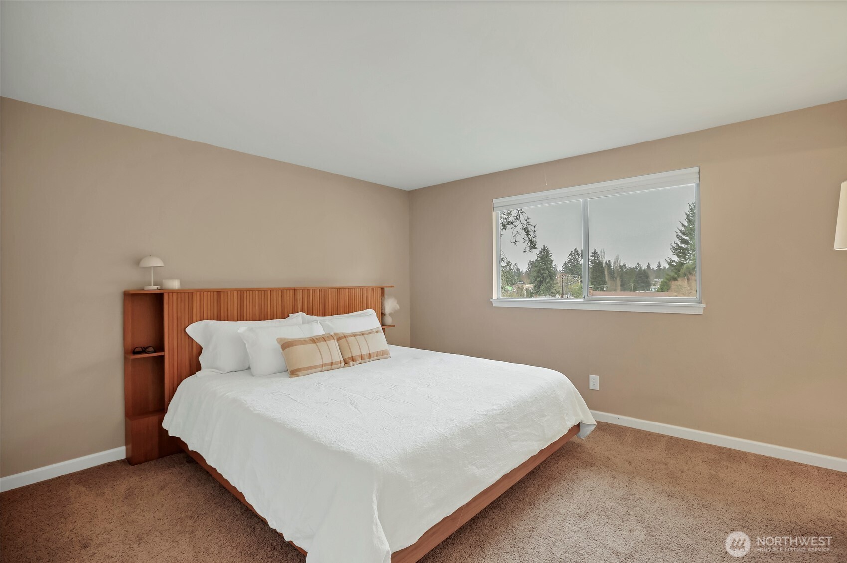 16387 129th Avenue Southeast Renton, WA 98058 - Photo 20 of 30 a bedroom with a bed and wall painting