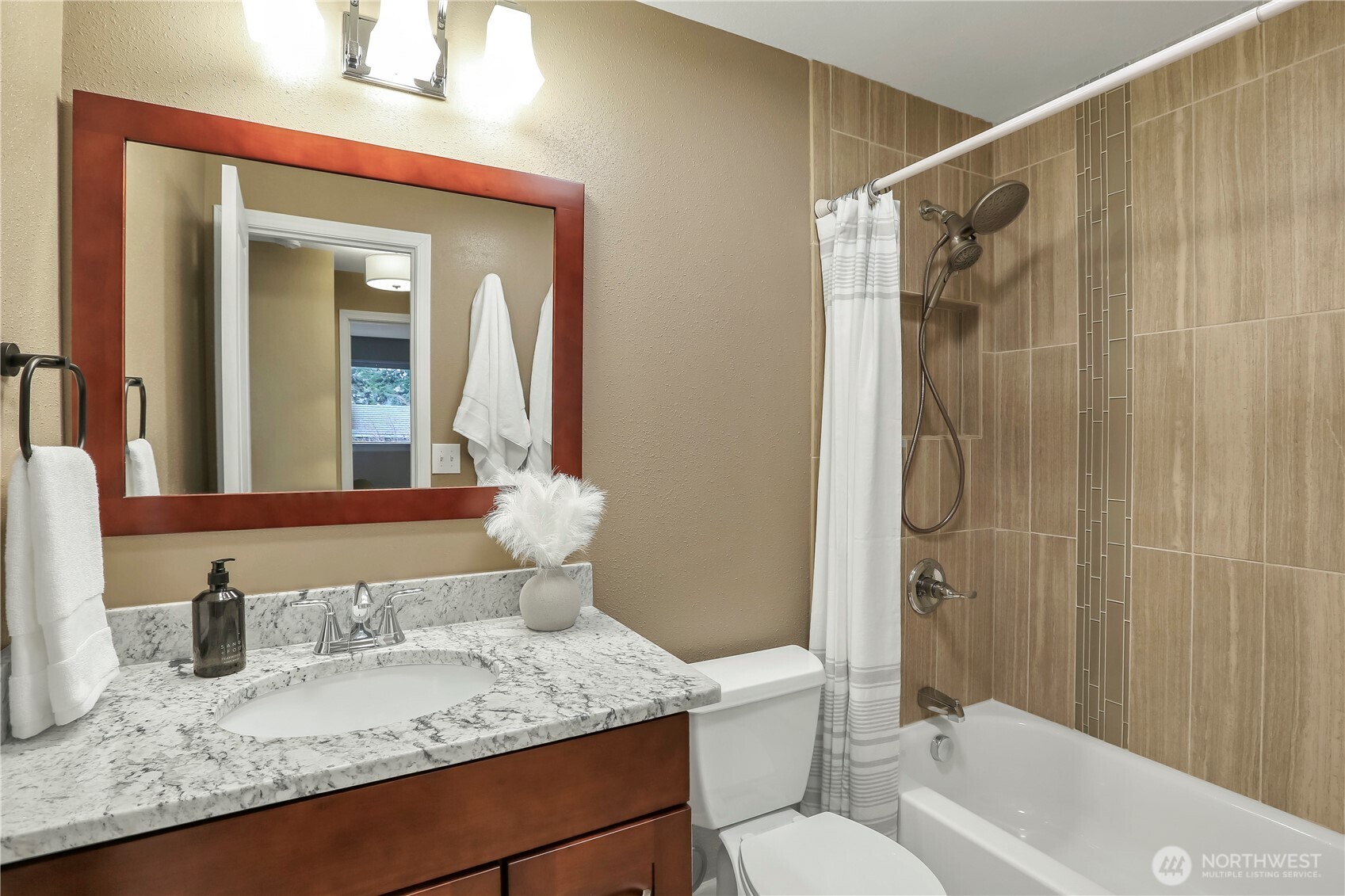 16387 129th Avenue Southeast Renton, WA 98058 - Photo 24 of 30 a bathroom with a granite countertop sink mirror vanity and toilet