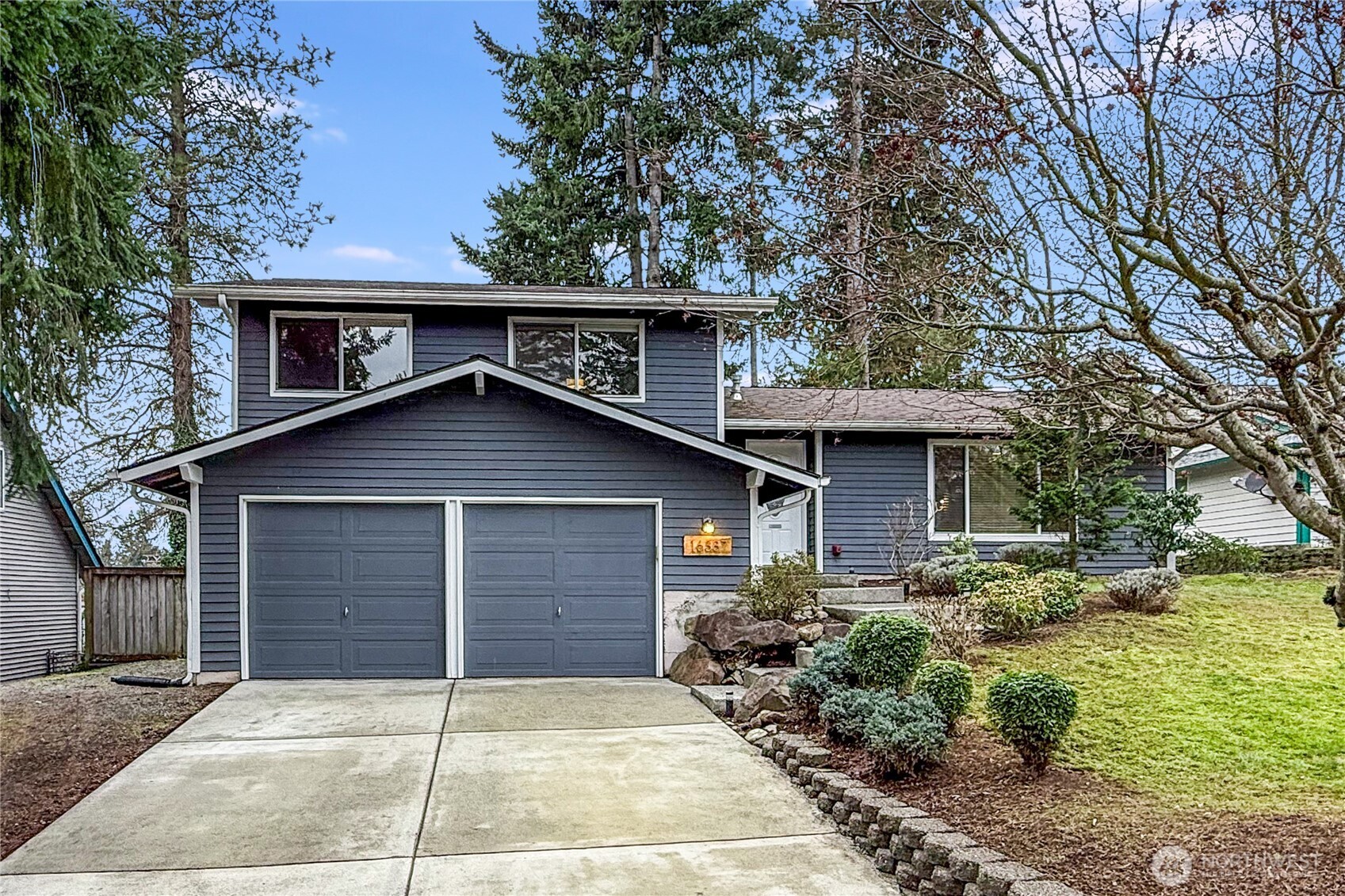 16387 129th Avenue Southeast Renton, WA 98058 - Photo 29 of 30 a front view of a house with garden