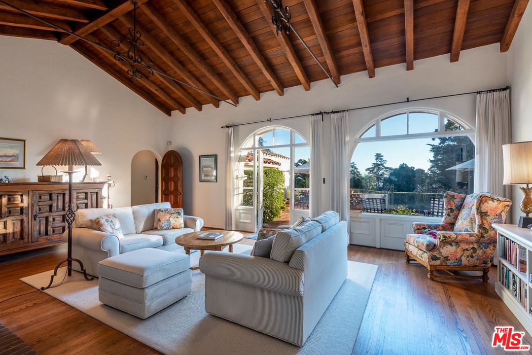 1806 El Encanto Road Santa Barbara, CA 93103 - Photo 5 of 20 a living room with furniture fireplace and a large window