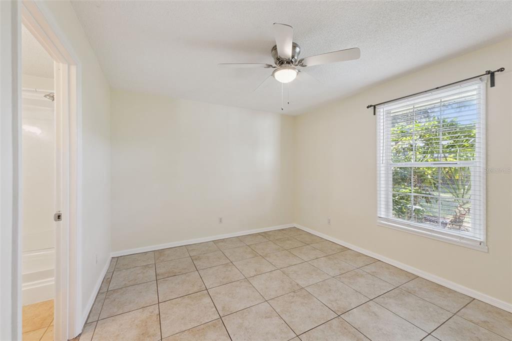 212 Ridge Crest Loop, Unit B Minneola, FL 34715 - Photo 12 of 21 a view of an empty room with a window