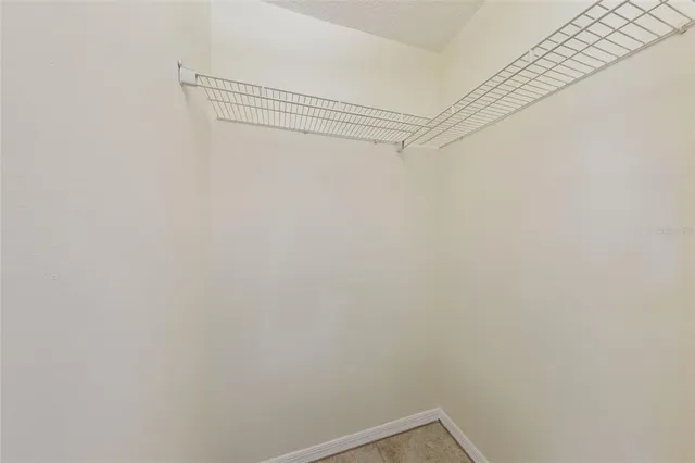 a view of a room with shelf on the wall