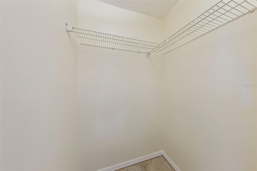212 Ridge Crest Loop, Unit B Minneola, FL 34715 - Photo 14 of 21 a view of a room with shelf on the wall