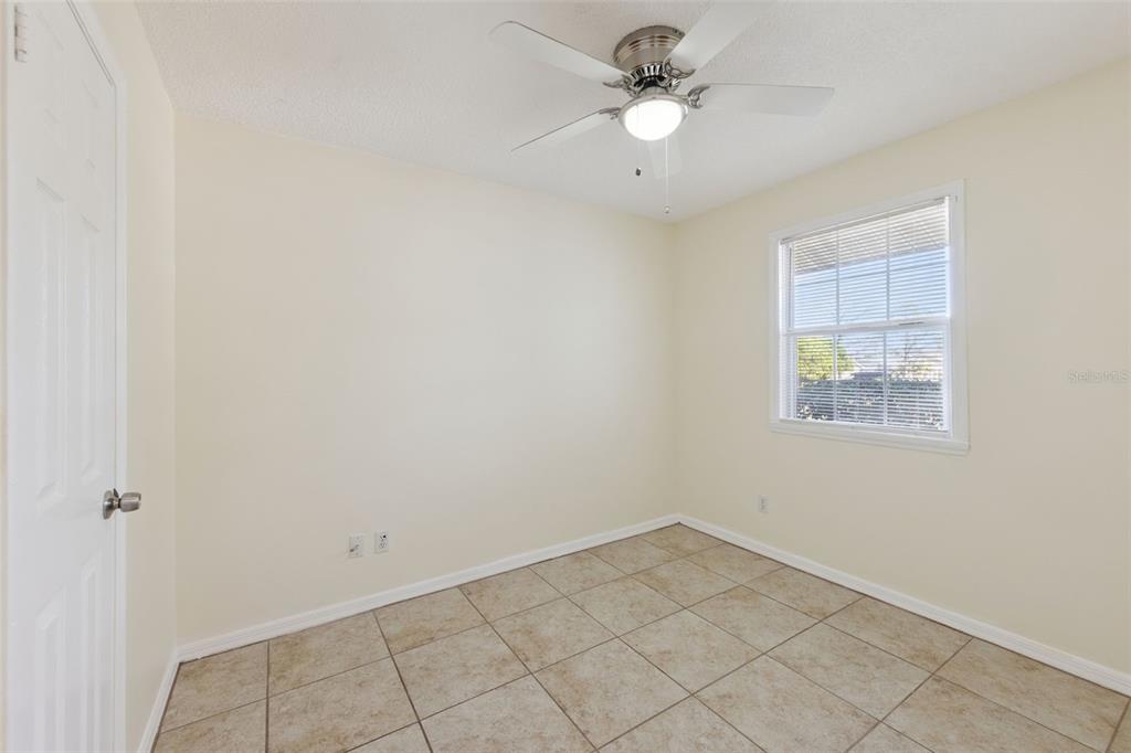 212 Ridge Crest Loop, Unit B Minneola, FL 34715 - Photo 19 of 21 an empty room with a window