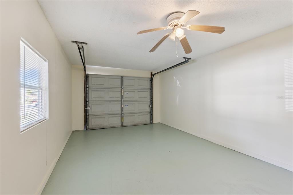 212 Ridge Crest Loop, Unit B Minneola, FL 34715 - Photo 20 of 21 a view of room with window and ceiling fan