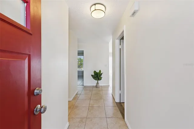 a view of a hallway with paintings on the wall