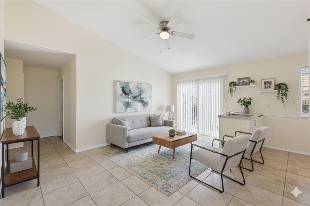 212 Ridge Crest Loop, Unit B Minneola, FL 34715 - Photo 5 of 21 a living room with furniture and a potted plant