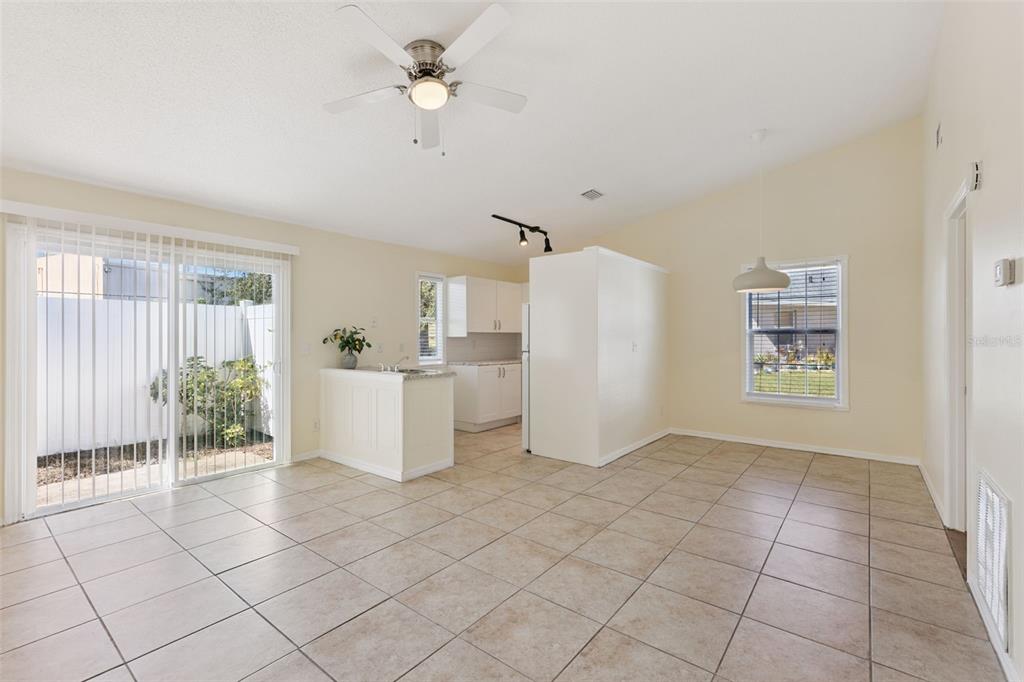 212 Ridge Crest Loop, Unit B Minneola, FL 34715 - Photo 6 of 21 a view of kitchen with furniture and refrigerator