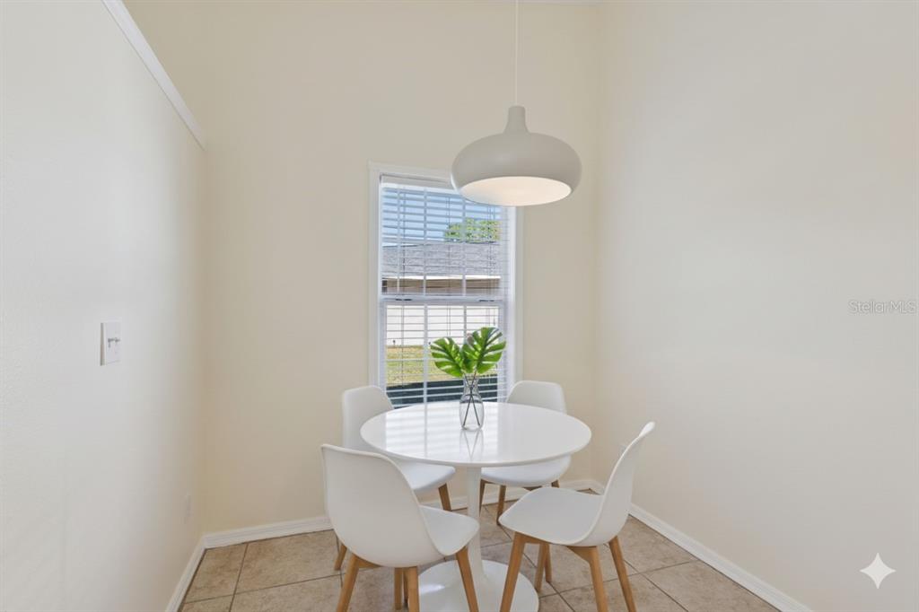 212 Ridge Crest Loop, Unit B Minneola, FL 34715 - Photo 7 of 21 a view of a room with a table and chairs