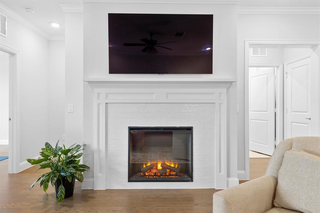 651 Watters Road, Unit 4403 Allen, TX 75013 - Photo 3 of 37 a living room with furniture and a fireplace