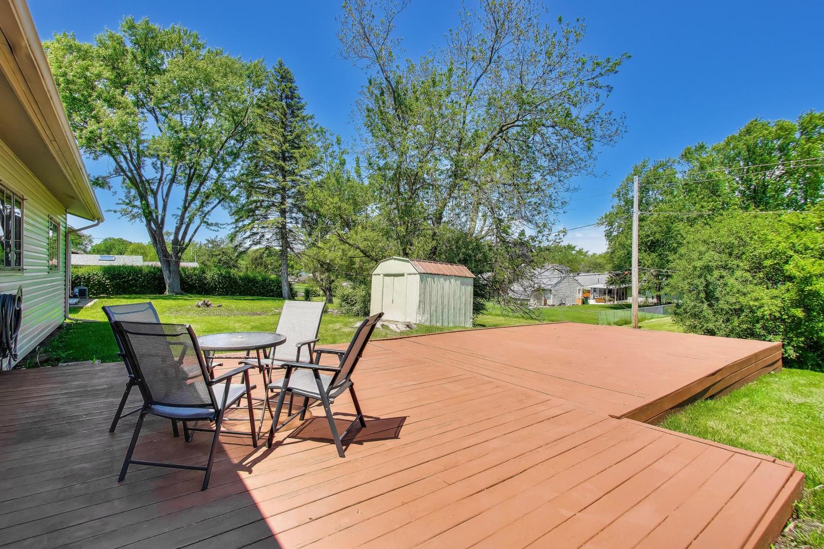 420 Bode Road Hoffman Estates, IL 60169 - Photo 14 of 20 a patio with yard glass top table and chairs