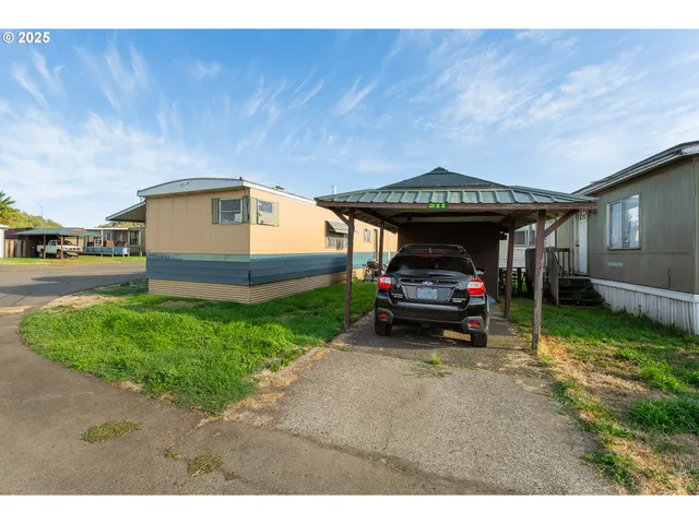a view of a car in front of a house