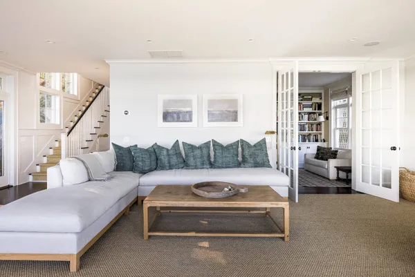 a living room with furniture and a table