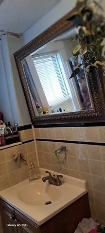 a bathroom with a sink and a mirror