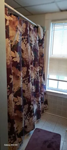 a room with water heater and a window