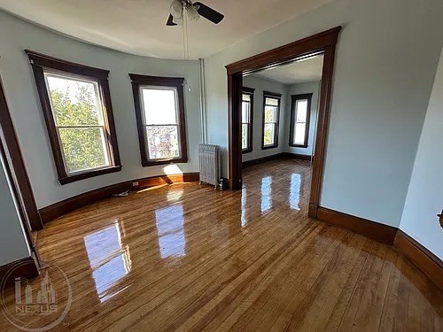 30 Pattison Street, Unit 2 Worcester, MA 01604 - Photo 19 of 32 an empty room with wooden floor and windows