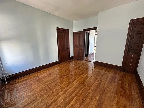 30 Pattison Street, Unit 2 Worcester, MA 01604 - Photo 23 of 32 a view of an empty room with wooden floor and a window
