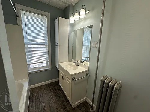 30 Pattison Street, Unit 2 Worcester, MA 01604 - Photo 28 of 32 a bathroom with a sink a toilet and mirror