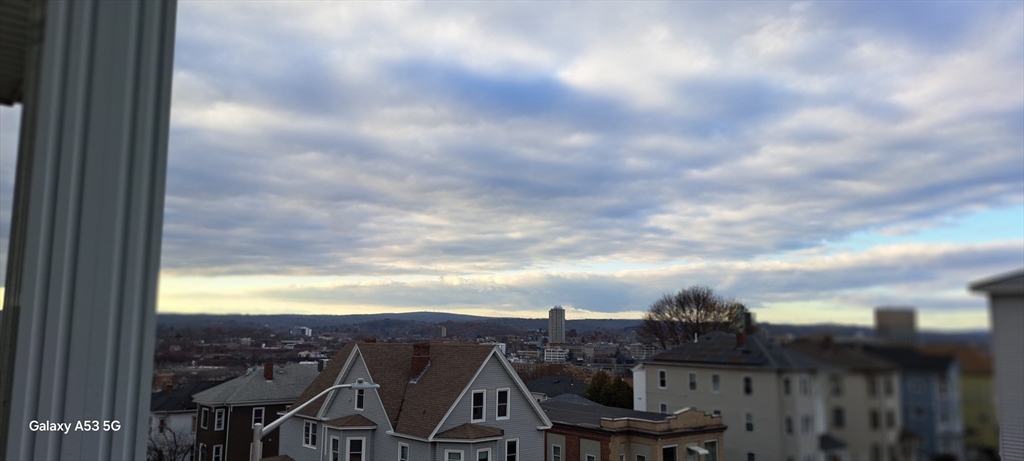 30 Pattison Street, Unit 2 Worcester, MA 01604 - Photo 6 of 32 a view of a city from a balcony