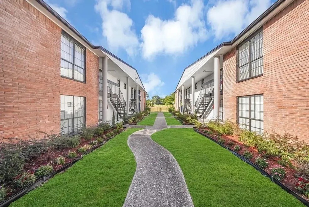 3316 North MacGregor Way, Unit 4 Houston, TX 77004 - Photo 15 of 37 a view of a building with a yard