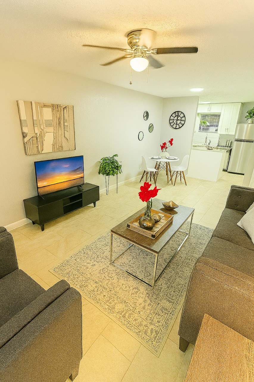 3316 North MacGregor Way, Unit 4 Houston, TX 77004 - Photo 3 of 37 a living room with furniture and a flat screen tv