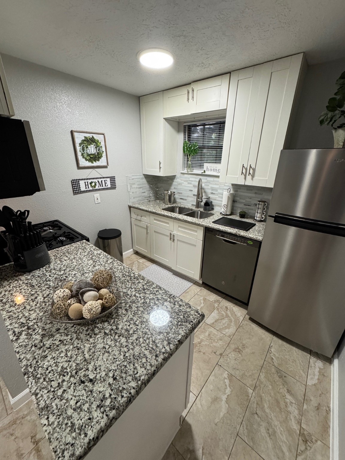 3316 North MacGregor Way, Unit 4 Houston, TX 77004 - Photo 5 of 37 a kitchen with stainless steel appliances granite countertop a sink stove and refrigerator