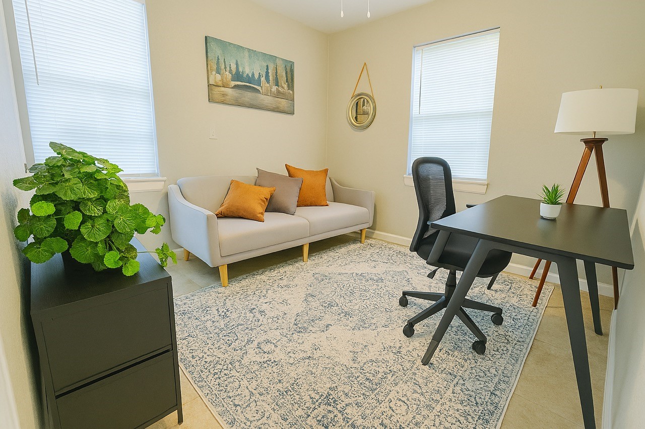 3316 North MacGregor Way, Unit 4 Houston, TX 77004 - Photo 10 of 37 a living room with furniture and a potted plant