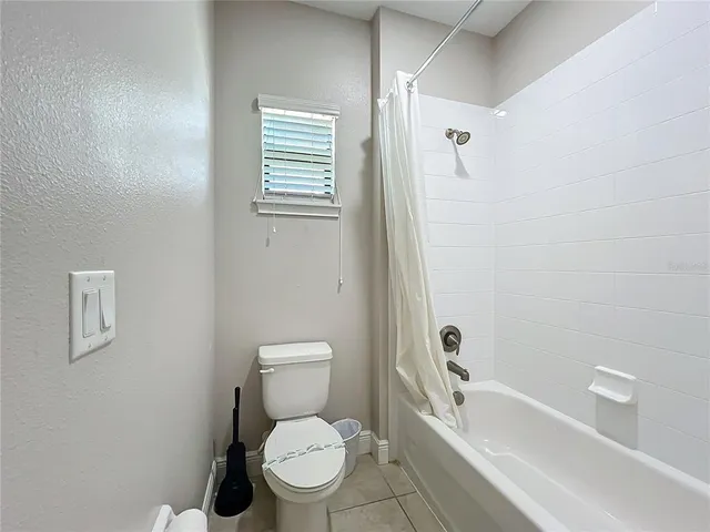 a bathroom with a toilet a sink and a bathtub