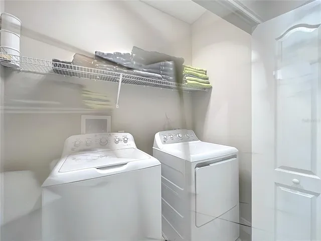 a utility room with dryer and washer