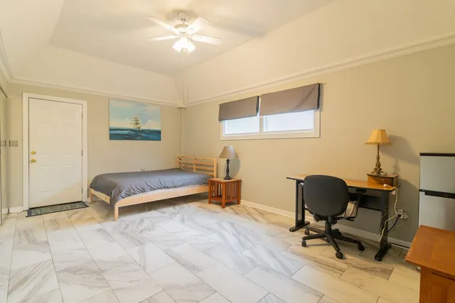 a bedroom with a workspace