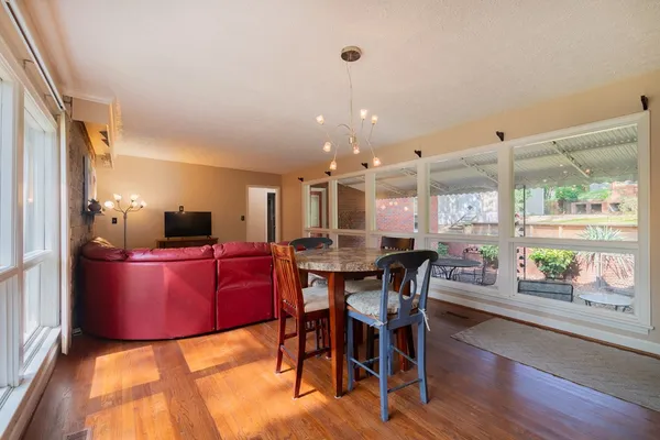 a large kitchen with dining table and chairs