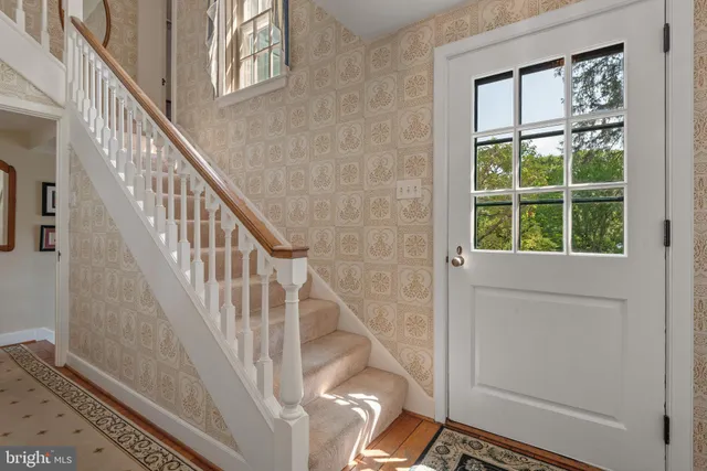 a view of a dining room with furniture wooden floor and chandelier