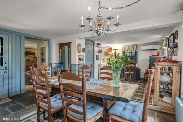a living room with furniture and a lamp