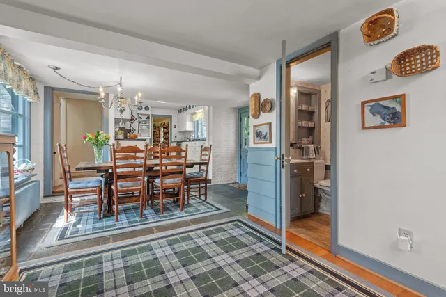 a bathroom with a window and a shower curtain