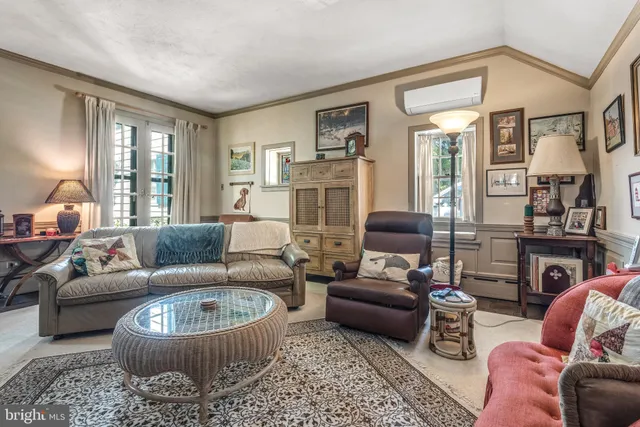 a view of a grassy field with trees in the background