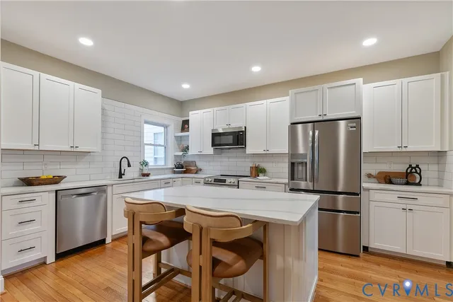 a living room with furniture rug and window